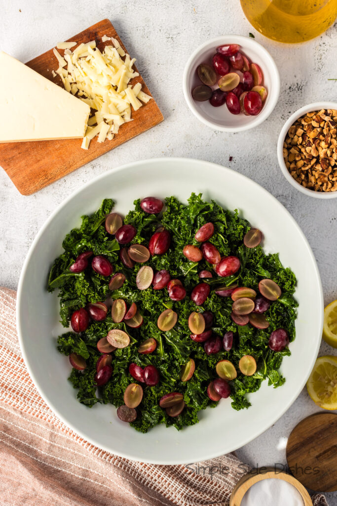 grapes added to massaged kale.