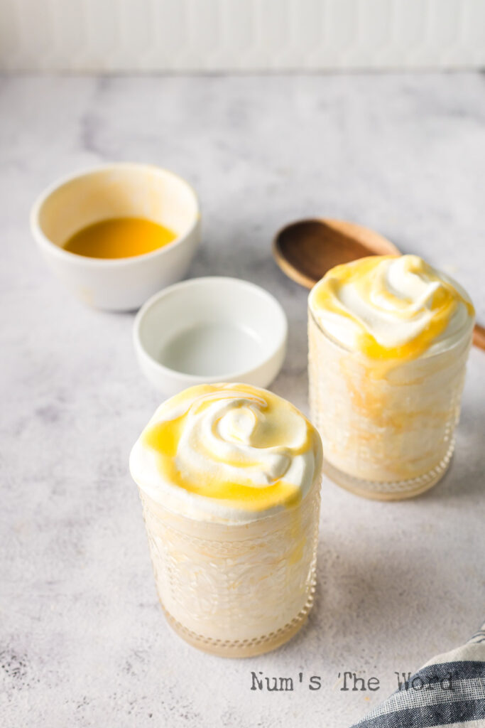 two jars of peach fool ready to serve